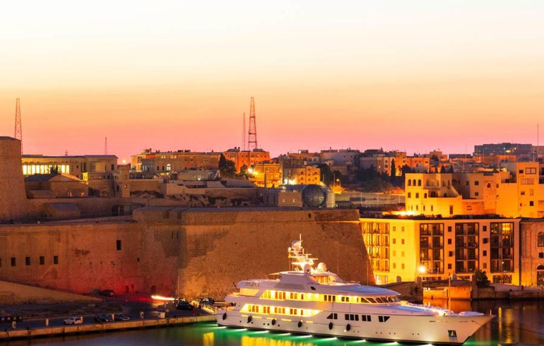 Lit Up Superyacht In Malta Harbour At Dusk | Praxis