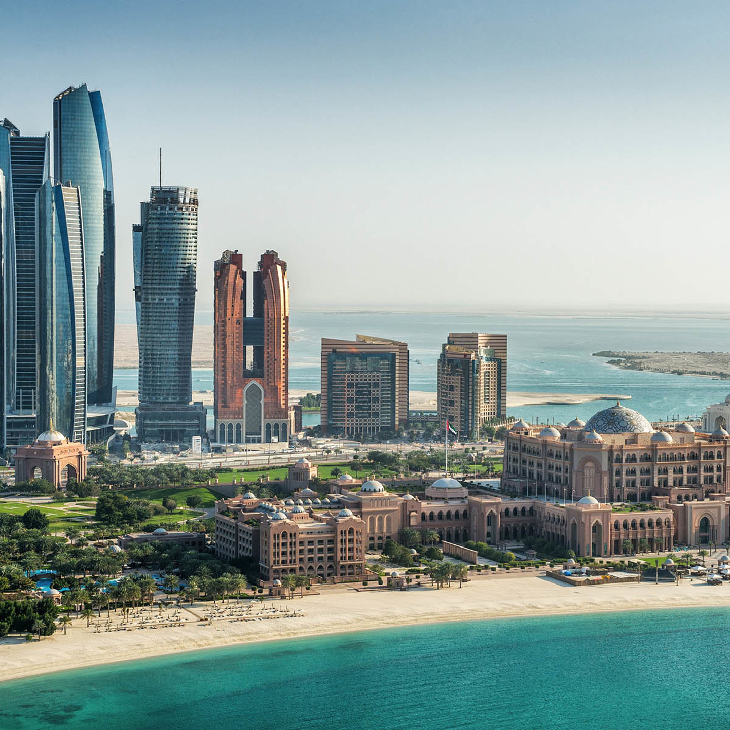 The beach with many skyscrapers in the background