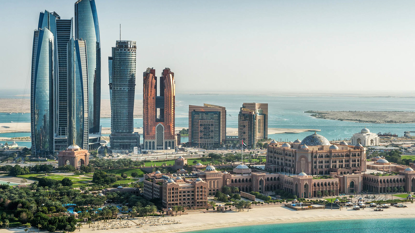 The beach with many skyscrapers in the background