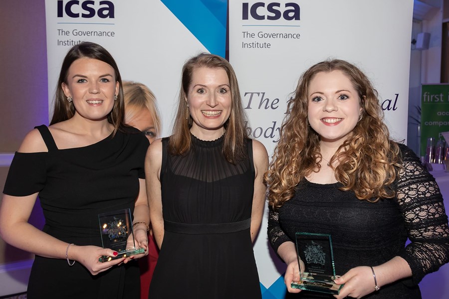 Gemma Woods posing with 2 other woman at the ICSA Awards with her trophy 