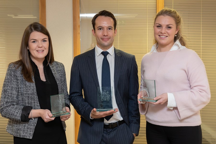 Gemma Woods, Matt Falla and Gwen Norman posing side by side with their ICSA Awards 