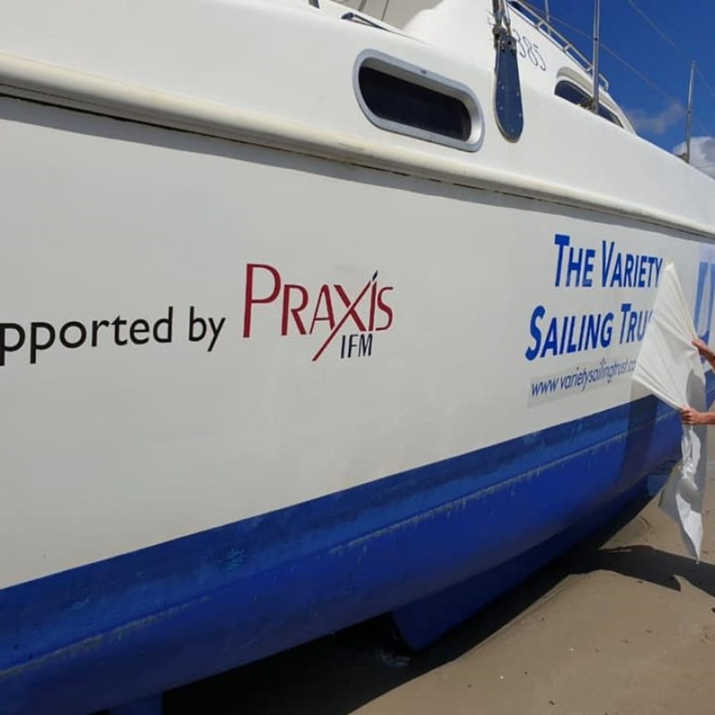 An image of a boat with the Praxis IFM logo printed on it as a sponsor