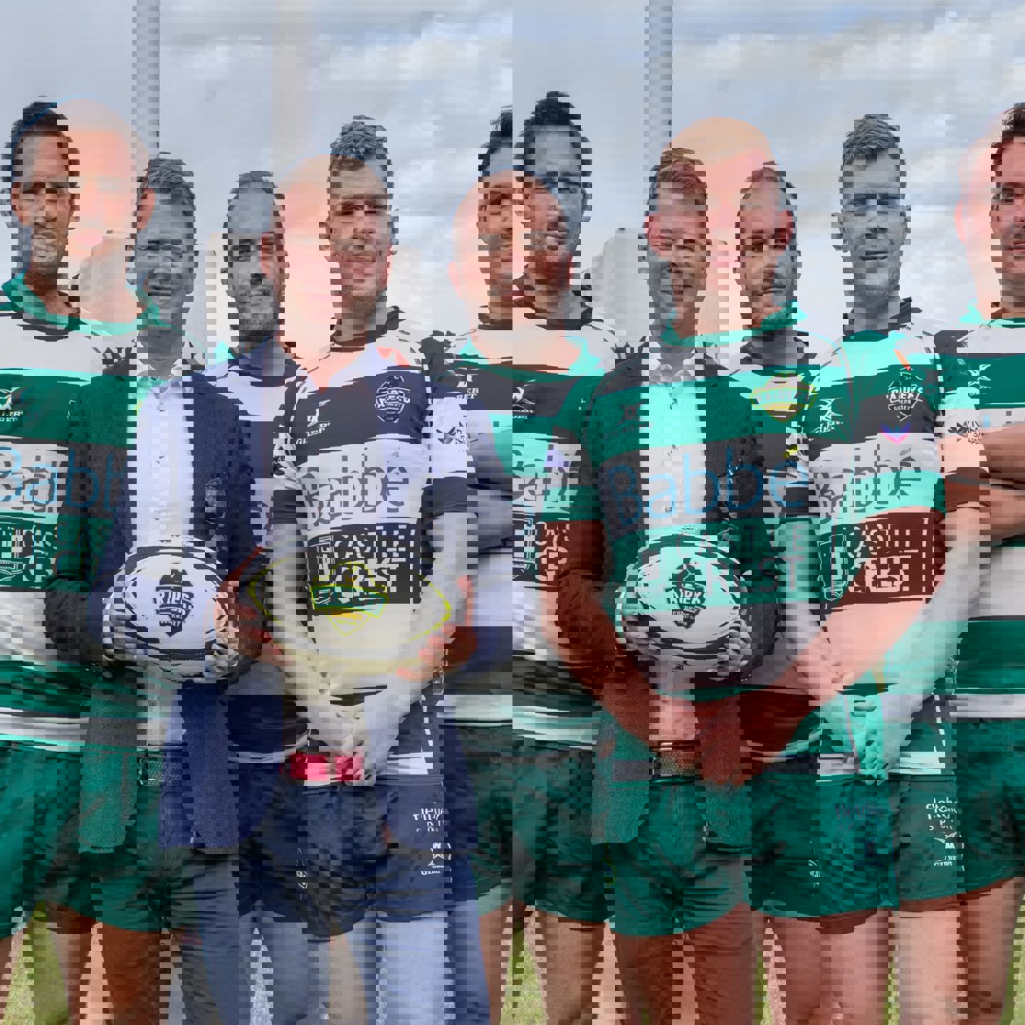 Matt Litten posing with 4 of the Guernsey Raiders rugby team on the Rugby field