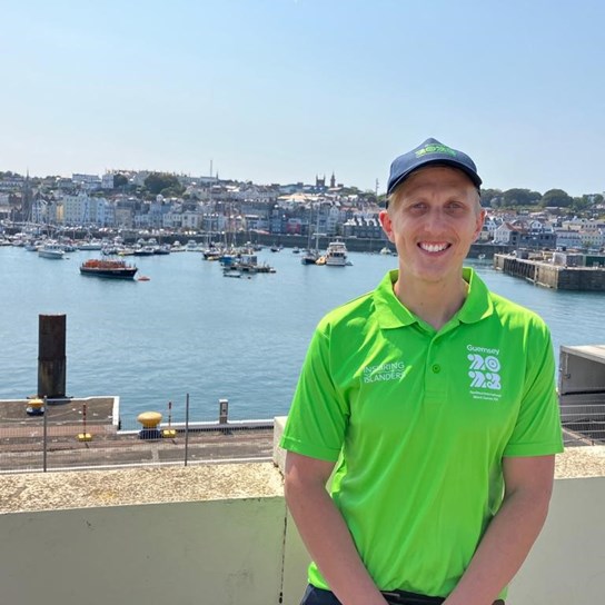 Alex Smedley at Guernsey Harbour wearing Island Games volunteer kit