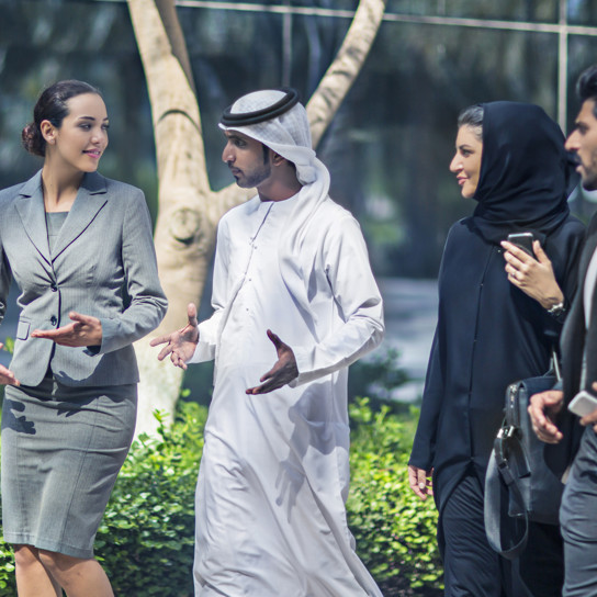Middle Eastern Business People Talking In The Street | Praxis