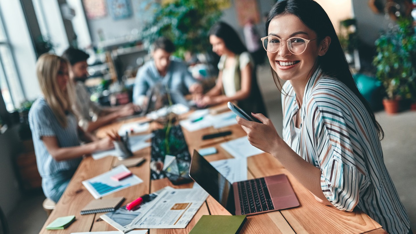 Group of young business people working together in modern office