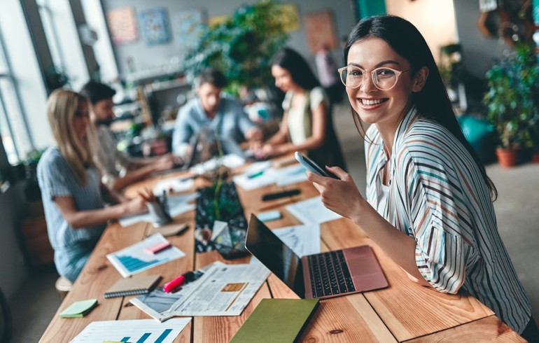 Group of young business people working together in modern office