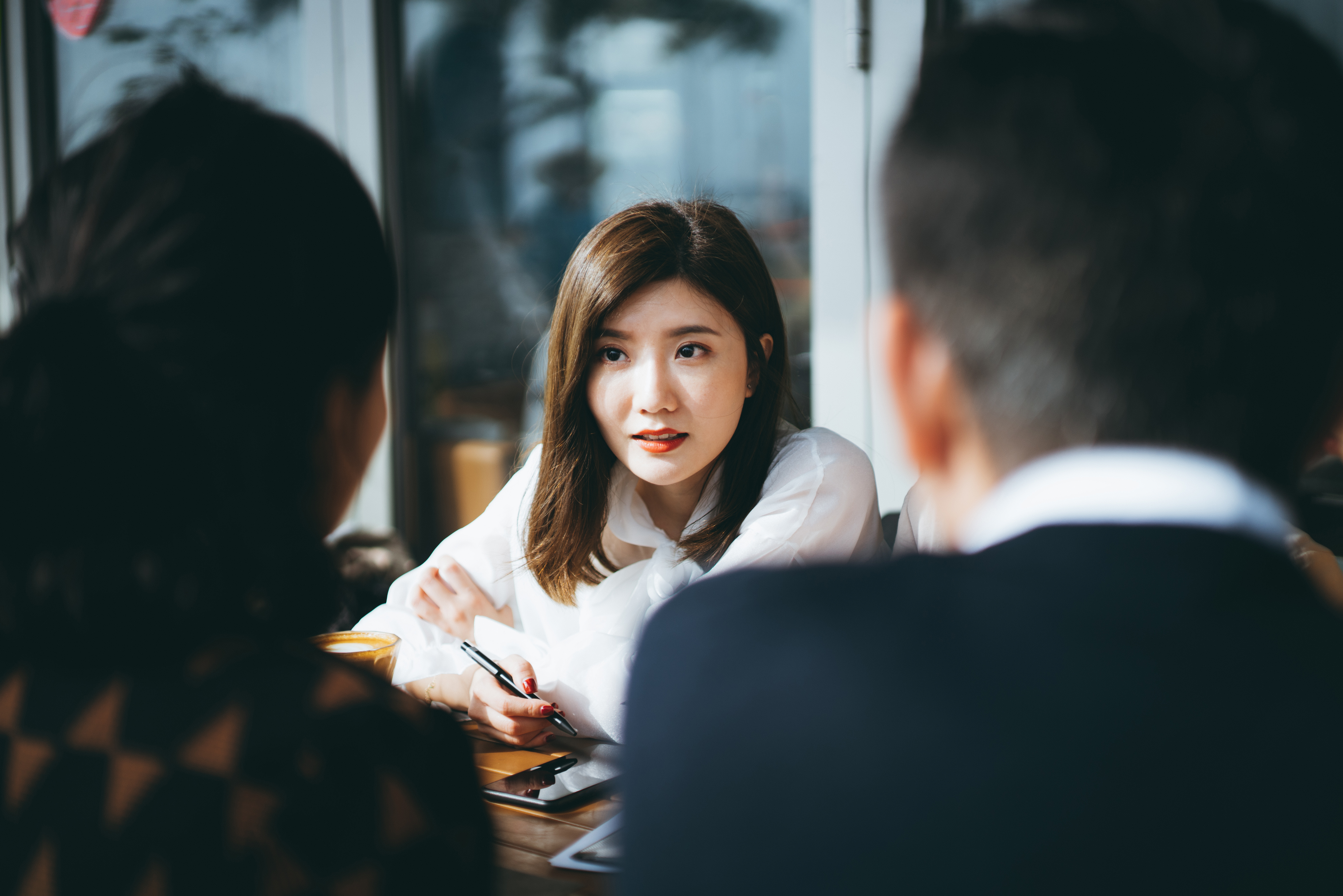 Woman Listening In A Meeting