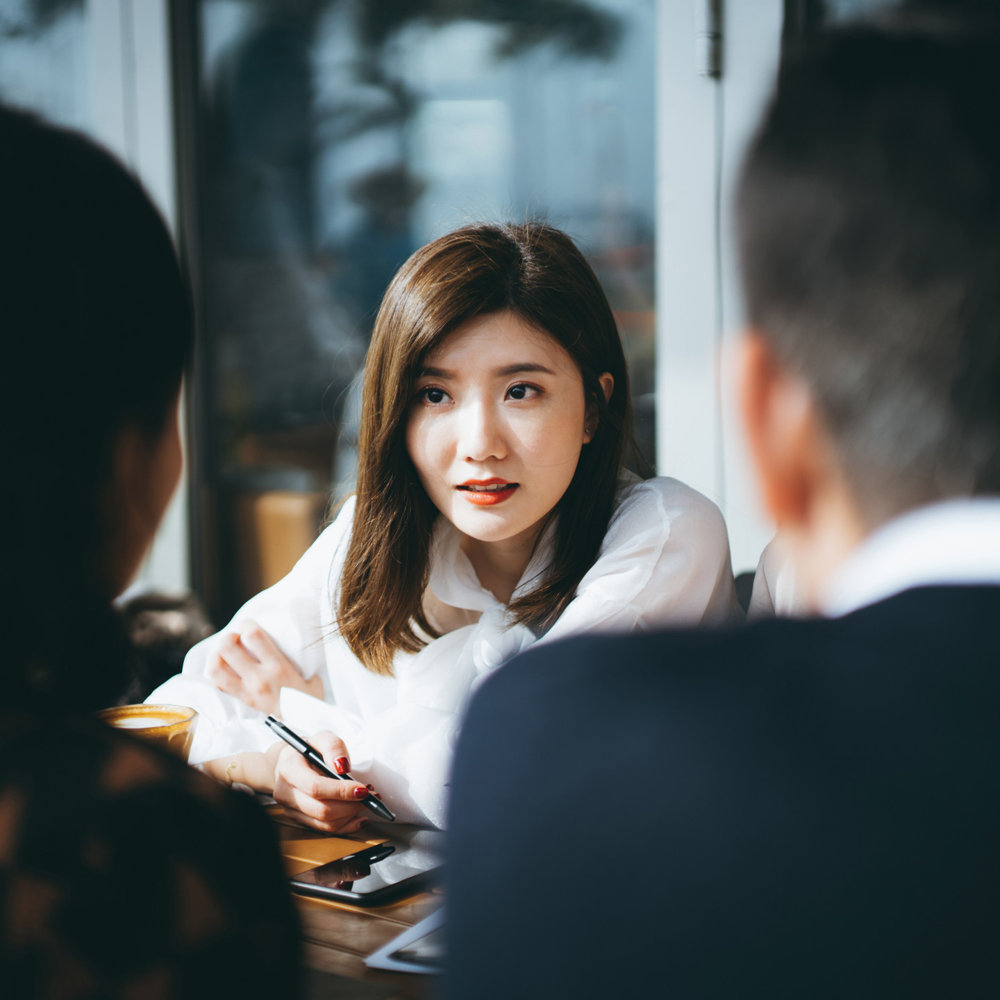 Woman Listening In A Meeting