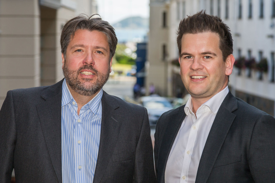  Rupert Pleasant and Paul Blackwell standing side by side outside the Guernsey Office