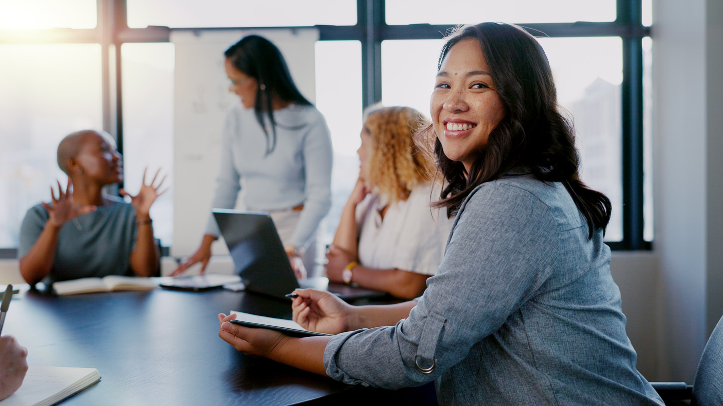 Group Of Women In A Meeting Smiling